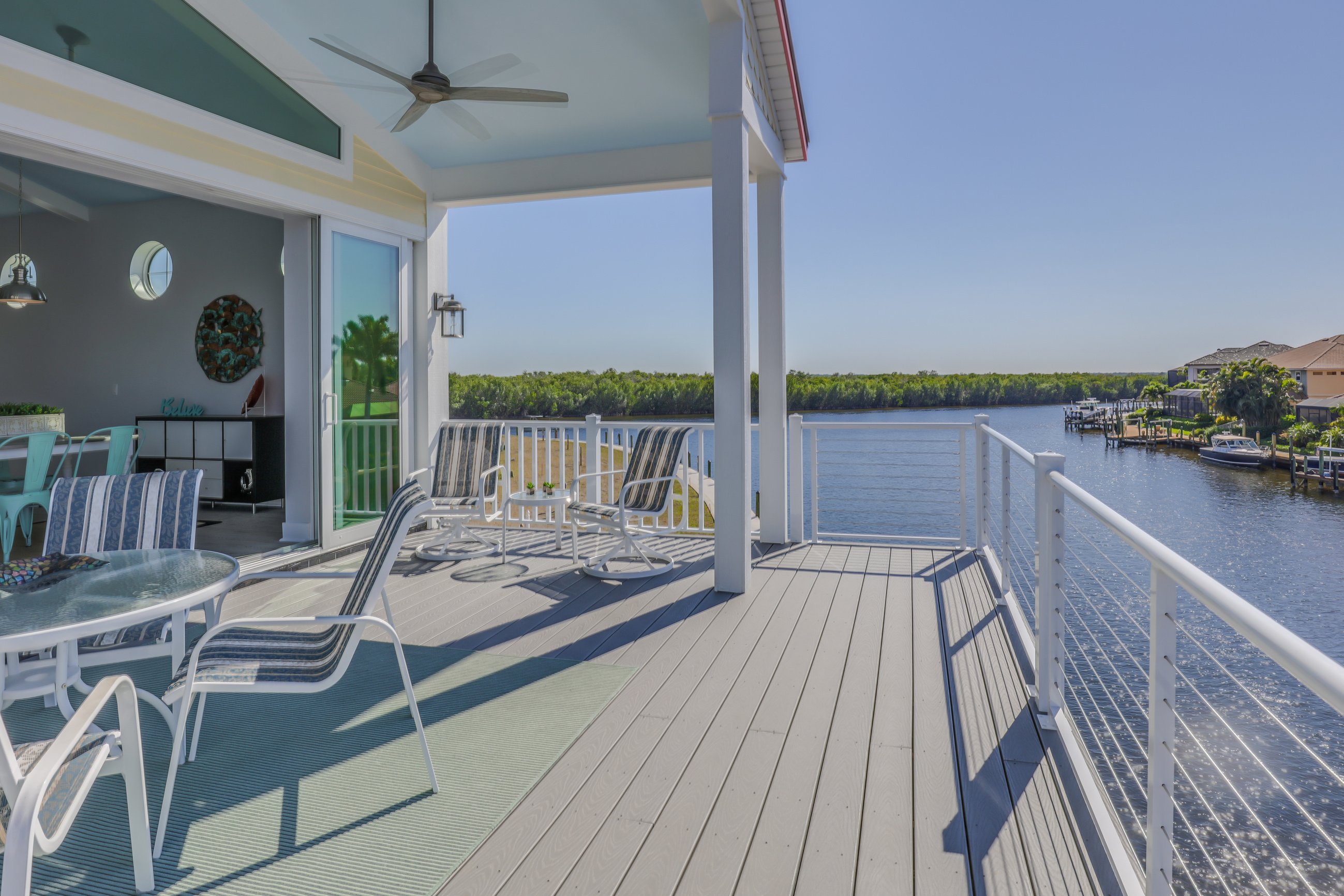 Large deck of Florida home looking over a canal